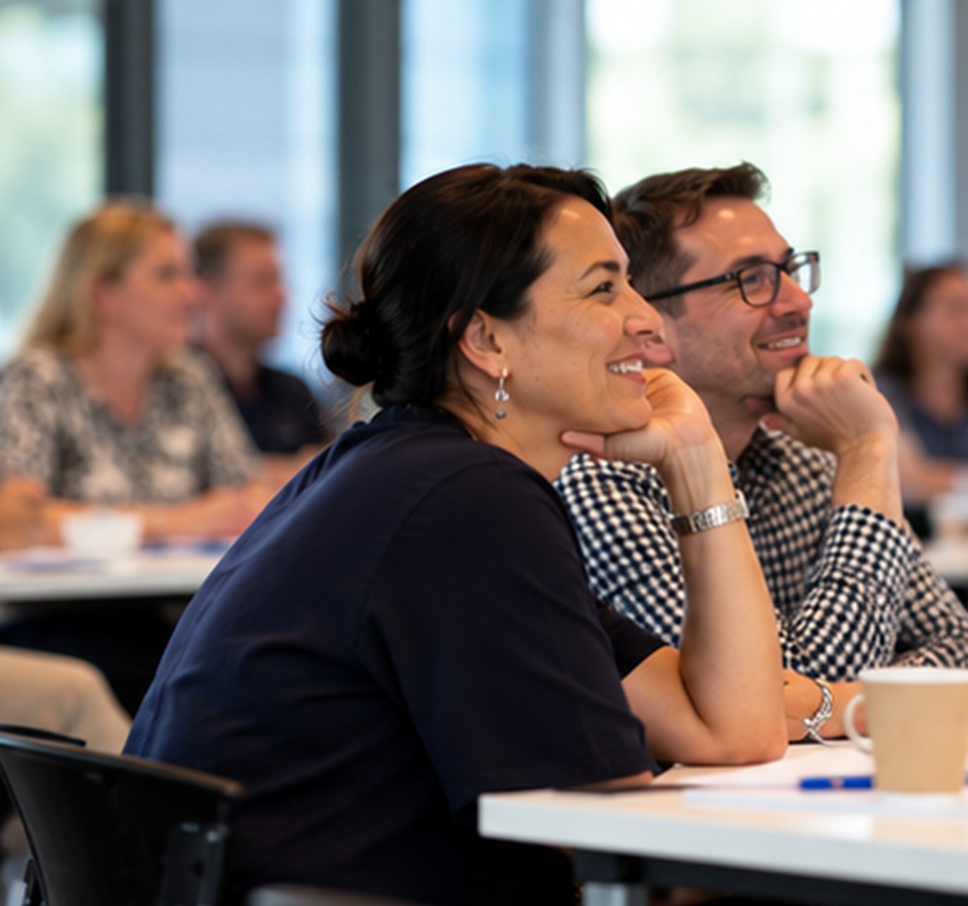 Workshop participants smiling during a session